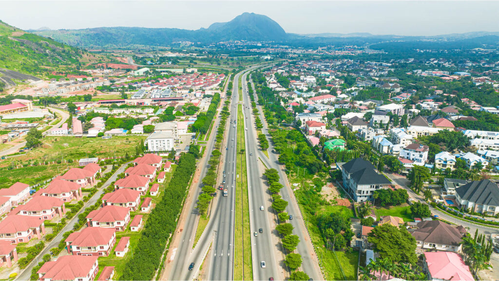 Aerial view of Abuja showing the expressway, city districts and Aso Rock