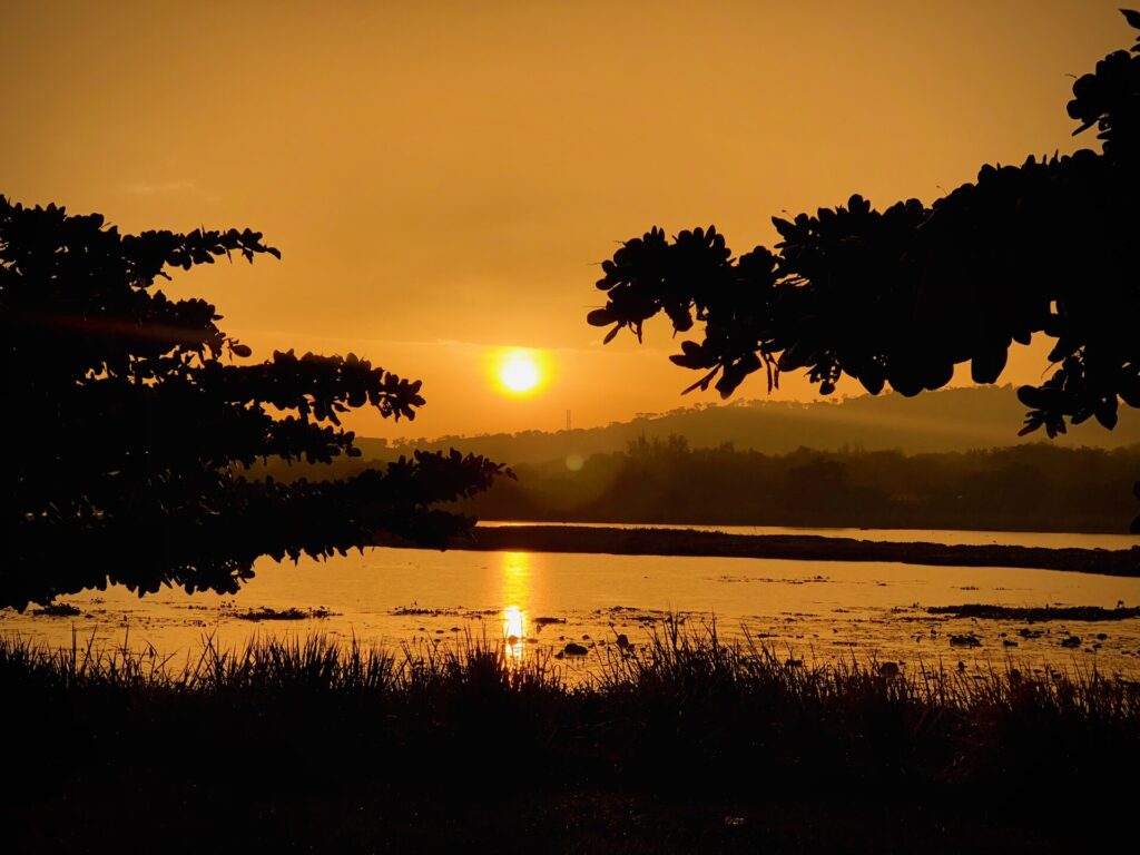Orange sunset reflecting on the water at Jabi Lake, Abuja
